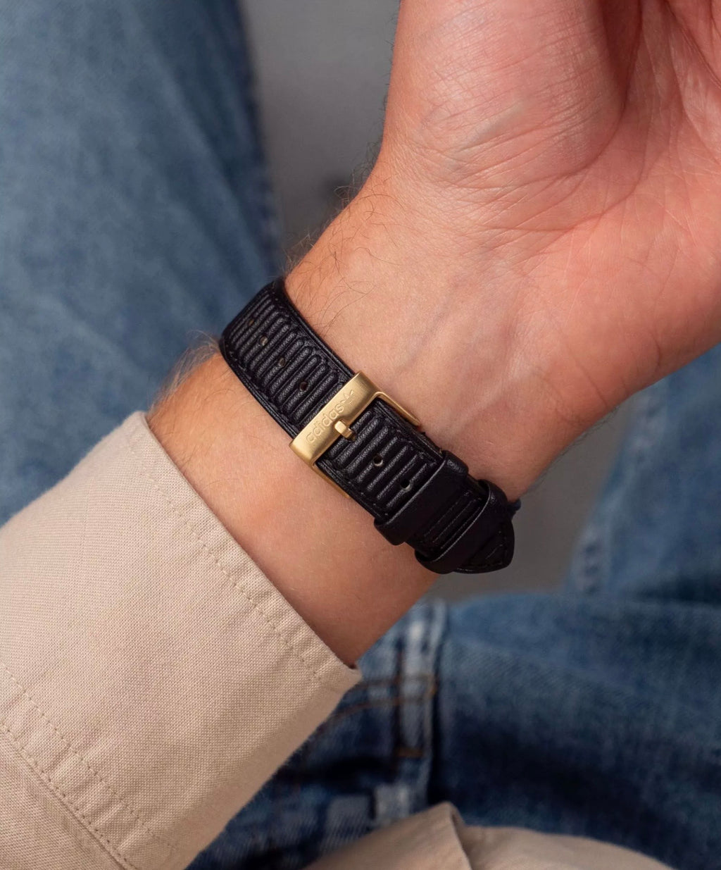 Adidas AOSY24528 watch worn on a wrist.