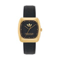 Front view of Adidas AOSY24528 watch with a black dial, gold coloured square case and ribbed black strap.