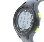 Close-up of Timex TW5M41500 watch showing the digital display and bright green case button.