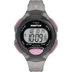 Front view of Timex TW5M65700 watch with a digital display, grey strap and pink buttons.