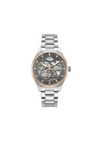 Kenneth Cole men's Ashton silver skeleton automatic watch showing a detailed open-worked dial and stainless steel band.